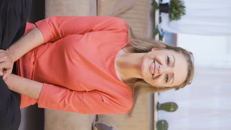 Vertical-video-of-Woman-winking-at-camera.